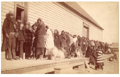 Native Americans wait in line for assistance