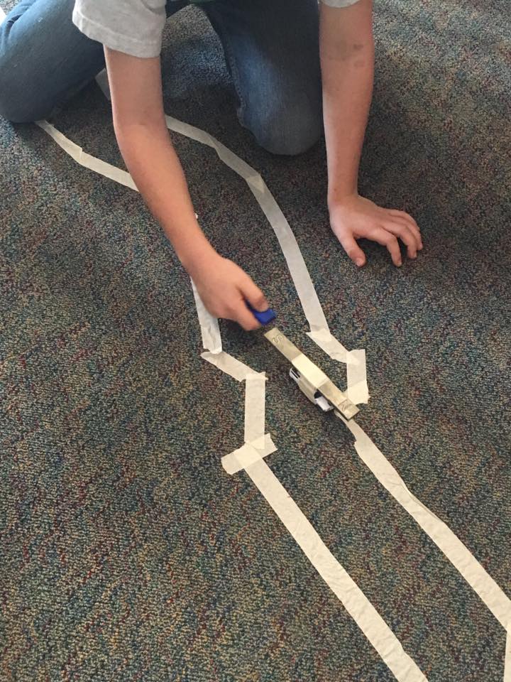 Using the magnet to push or repel the car along