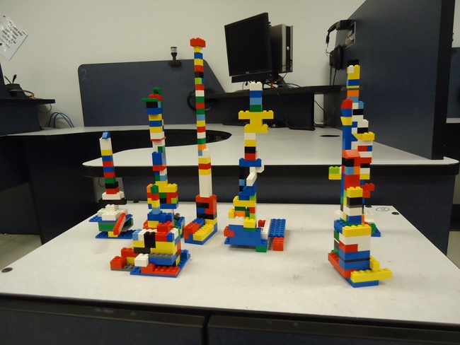 Towers of LEGO bricks made by students as part of teamwork activity.