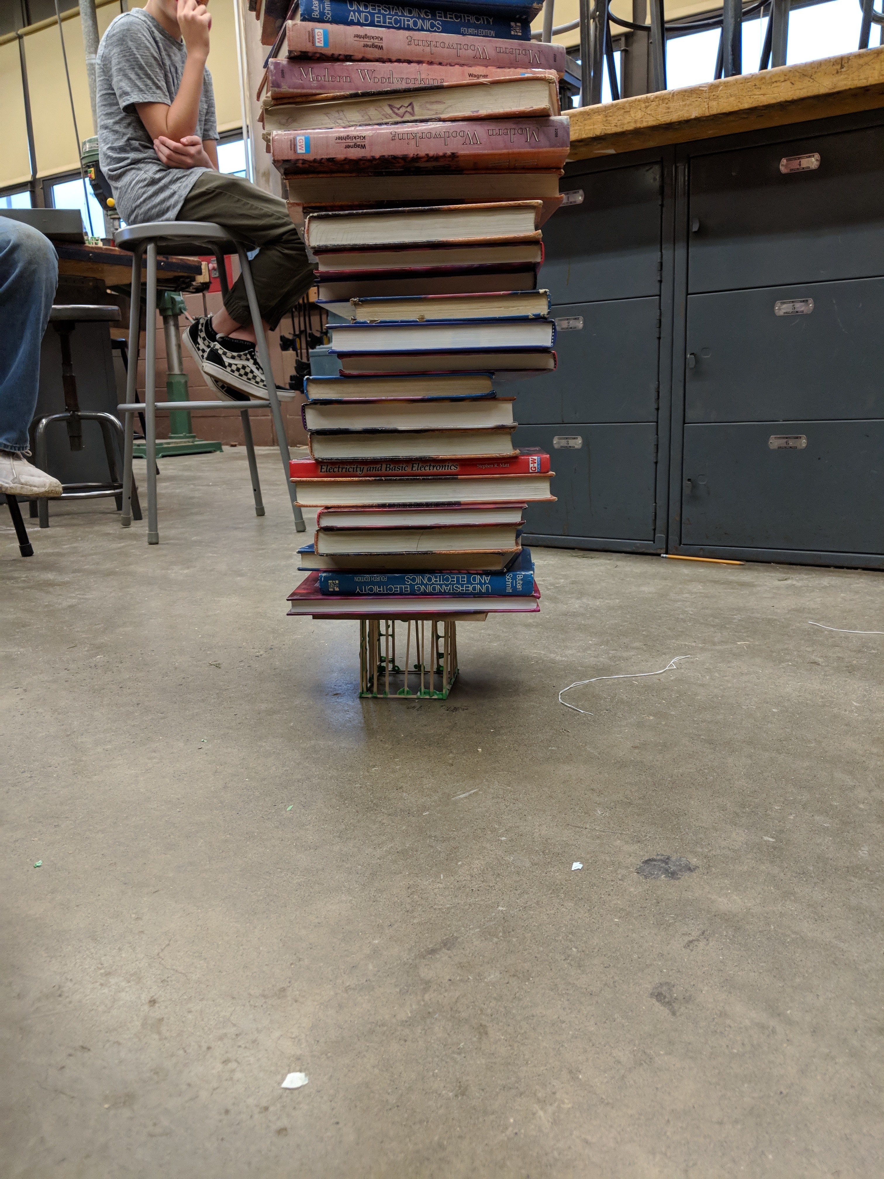 This is an image of a finished balsa wood cube being tested. I use books as weights, stacked on top of cube. We have had cubes that held over 200 pounds!