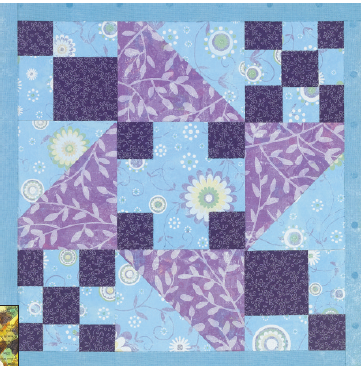 Quilt block made with decorative papers