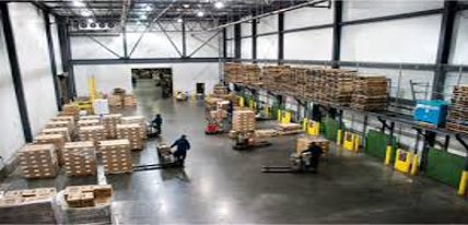 This is a dock or staging area in the warehouse where incoming and outgoing products are staged prior to putaway or loading.