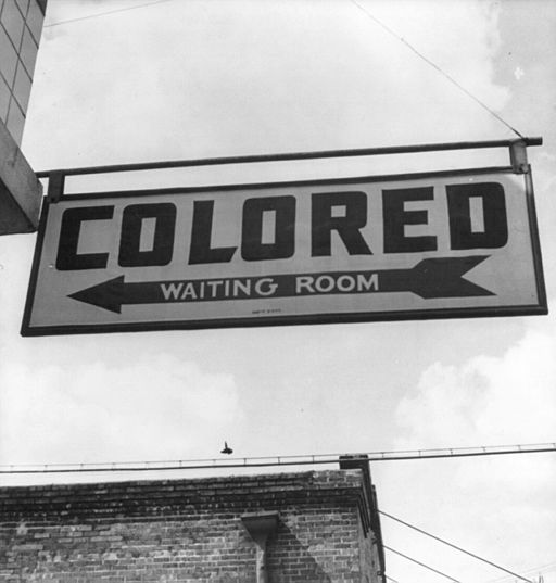 "Colored Waiting Room" sign from segregationist era United States. By Esther Bubley [Public domain], via Wikimedia Commons