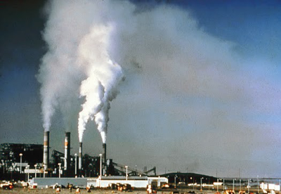 Air pollution billows from a power plant before the installation of emission control equipment 