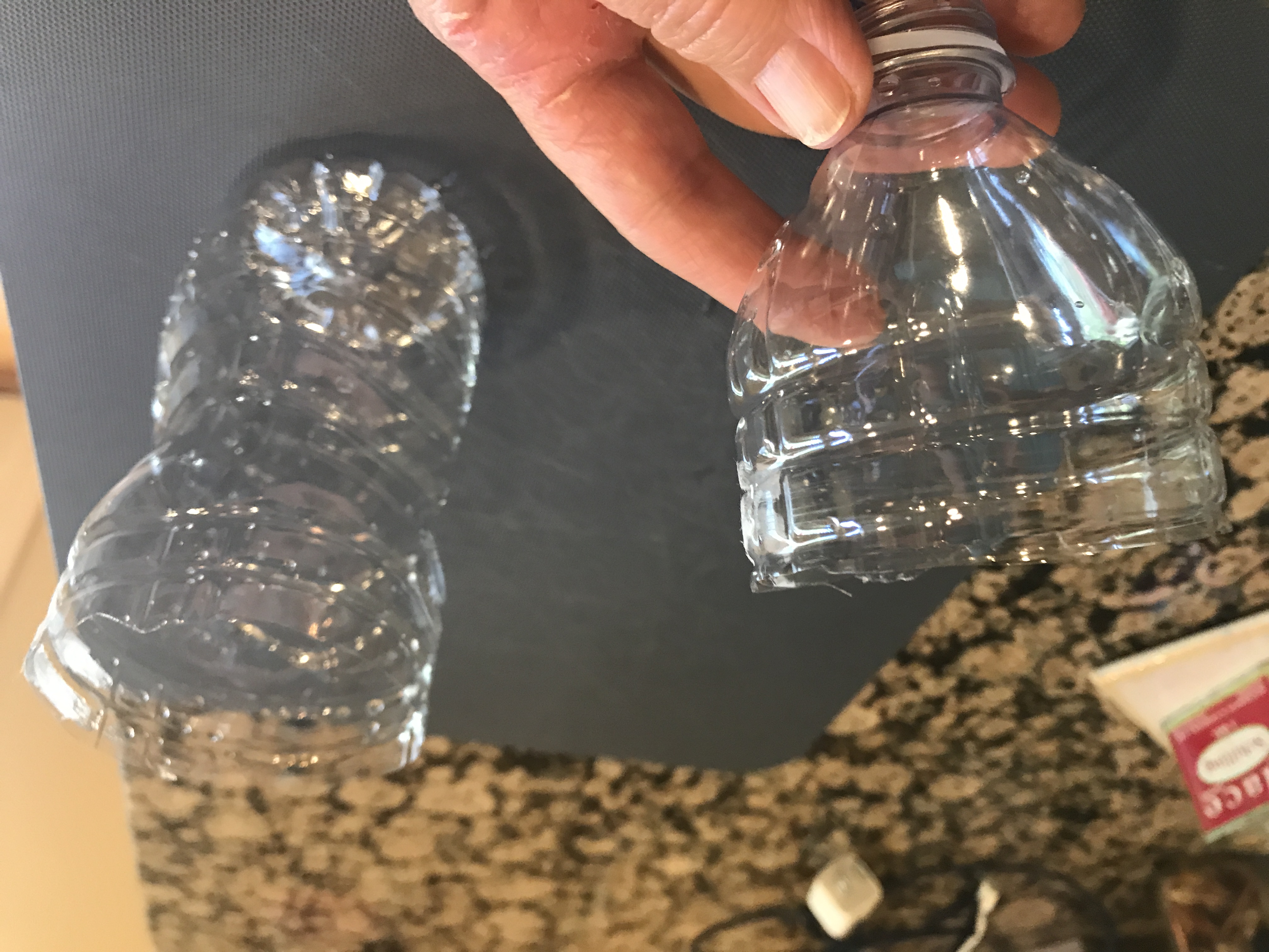 12 oz water bottle cut into a funnel and open container