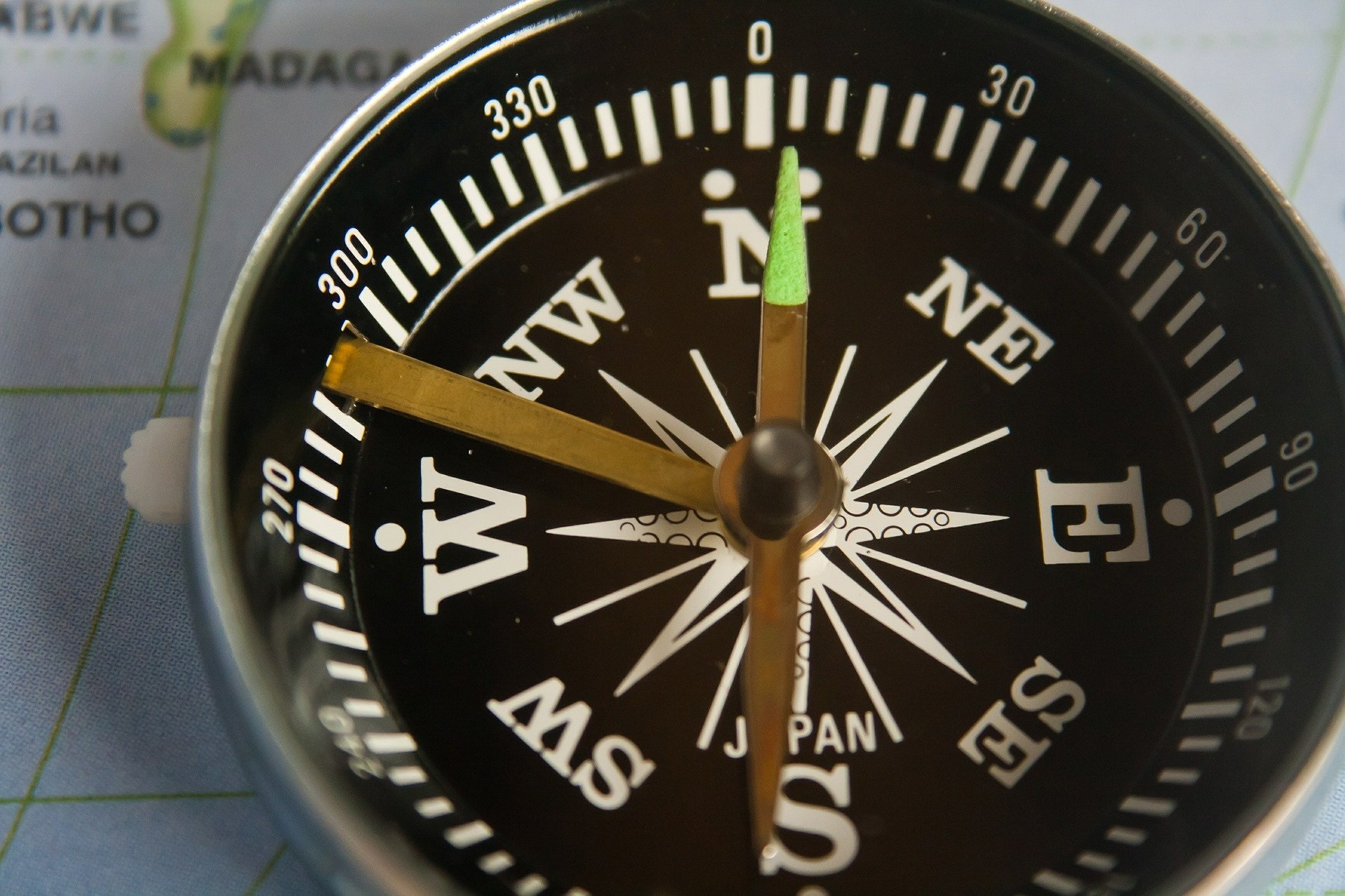 Photo of a compass on a map 