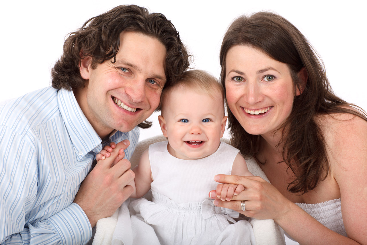 image of white family: man, woman, baby