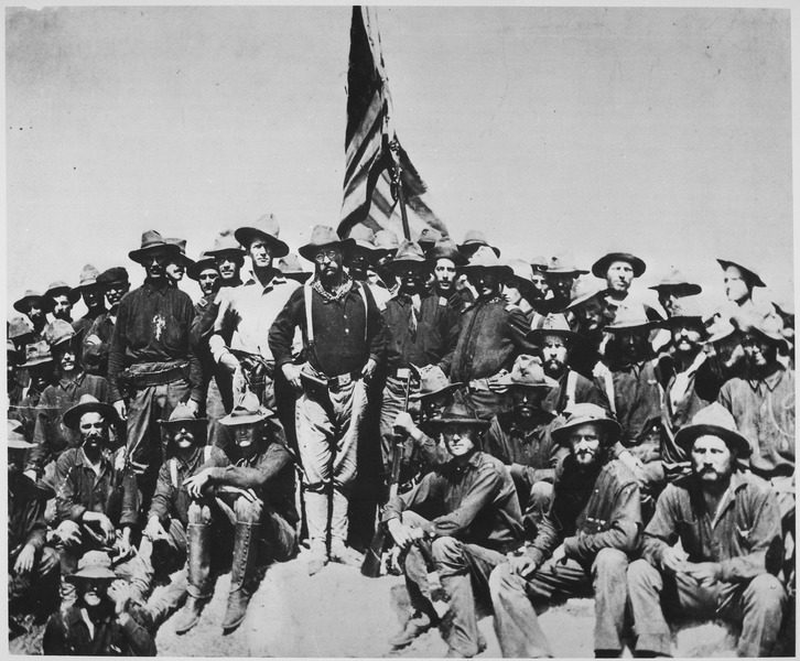 "Teddy's colts," at the top of the hill which they captured in the battle of San Juan." Colonel Theodore Roosevelt and his Rough Riders, 1898. (U.S. National Archives and Records Administration) [Public domain], via Wikimedia Commons.
