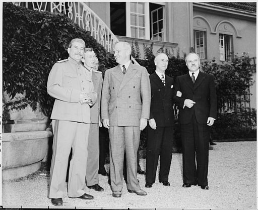 President Truman and Soviet Union Prime Minister Josef Stalin on the lawn in front of Prime Minister Stalin's residence during the Potsdam Conference, Potsdam, Germany. L to R: Prime Minister Josef Stalin, V. N. Pavlov, interpreter for Prime Minister Stalin, President Harry S. Truman, Secretary of State James Byrnes, and Soviet foreign minister Vyacheslav Molotov.
