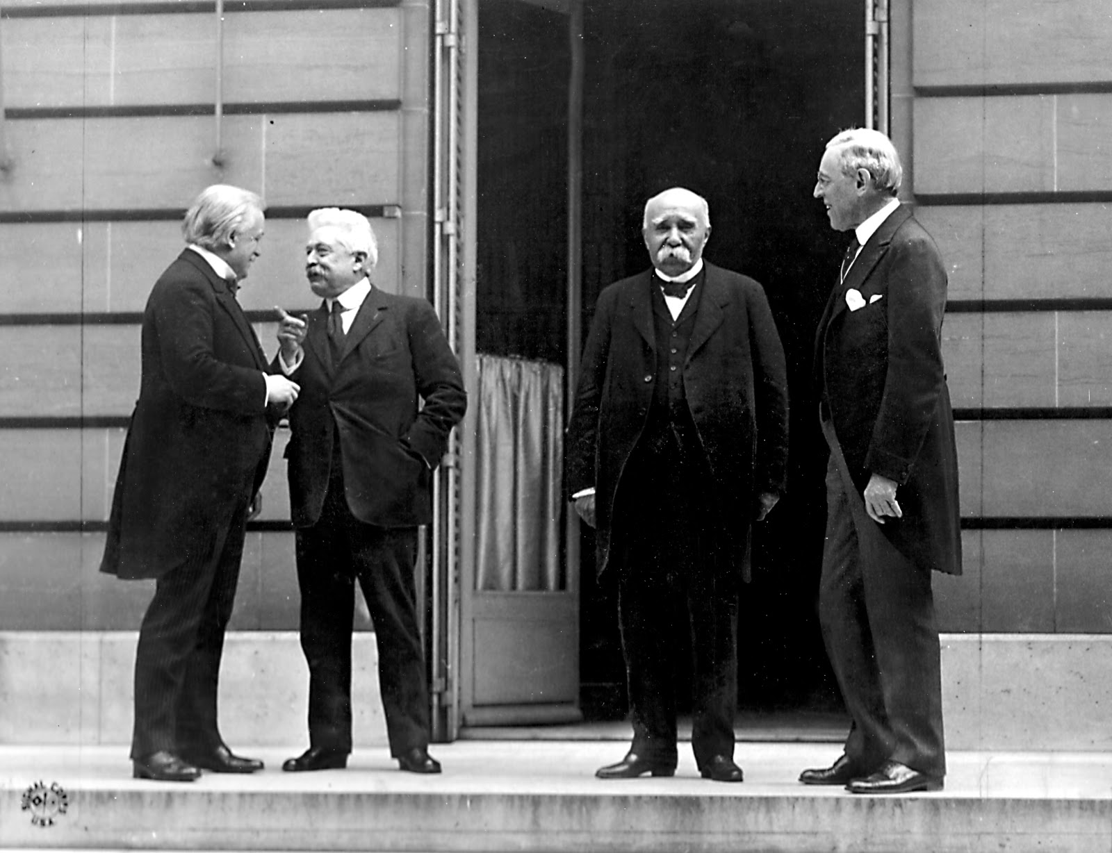 Council of Four at the WWI Paris peace conference, May 27, 1919: (Left - Right) Prime Minister David Lloyd George (Great Britain) Premier Vittorio Orlando, Italy, French Premier Georges Clemenceau, President Woodrow Wilson. By Edward N. Jackson (US Army Signal Corps) (U.S. Signal Corps photo) [Public domain], via Wikimedia Commons