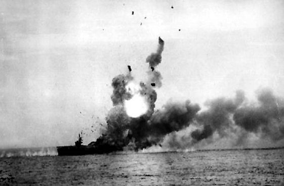 A carrier is shown with flames and smoke billowing out of it. 