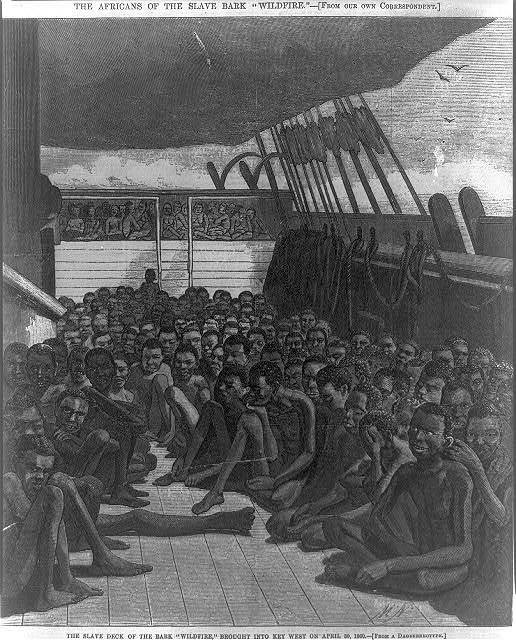Panting of Africans on a ship's deck.