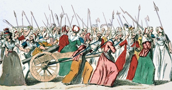 Women marching dragging a cannon