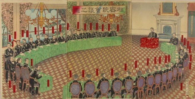 Print of a large room with 2 semicircular tables facing each other and a small table at the top right. The men seated around the long tables are white, dressed in 19th century suits. The emporer is seated at the red small table which is shorter that the long tables. 