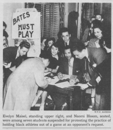 The "Bates Seven" and "Bates Must Play" signs