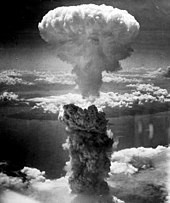 Black and white photo of iconic atomic bomb mushroom cloud