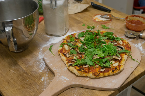 Image of pizza ready to be placed in an oven