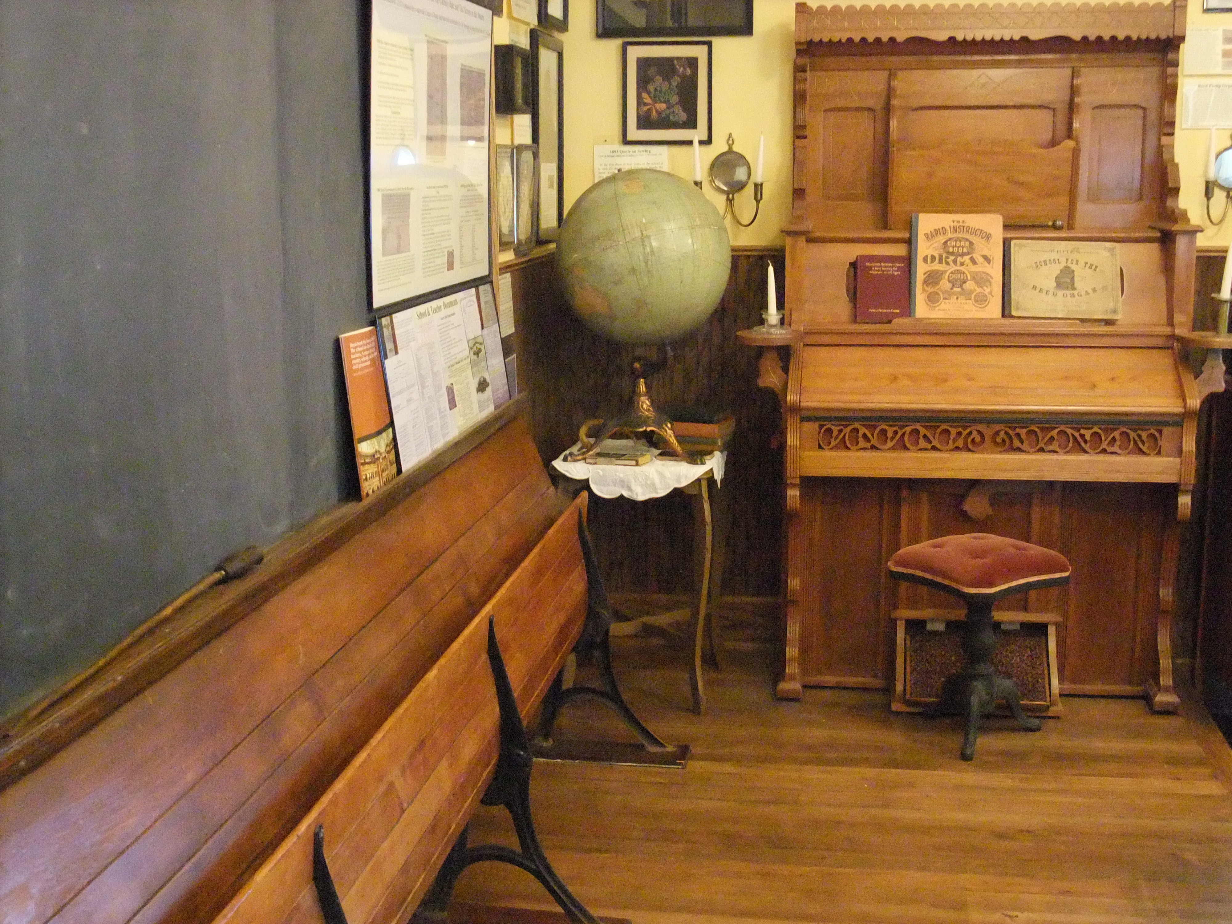 School furnishings  platform with recitation beach, 1900's globe and organ