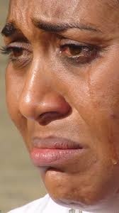 What do you feel when you see this woman crying?
Source: commons.wikipedia.org.