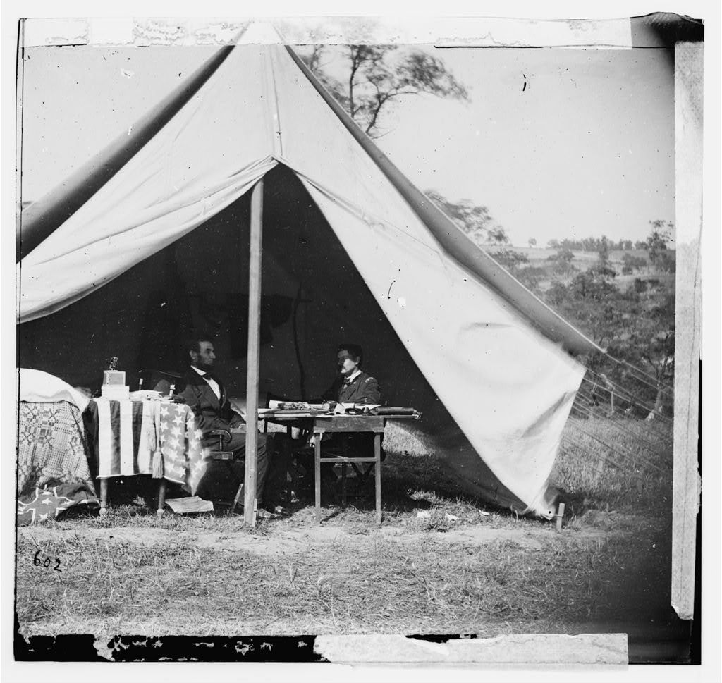 “Antietam, Md. President Lincoln and Gen. George B. McClellan in the general's tent; another view,” (cropped) by Alexander Gardner, [Public domain], via Library of Congress.